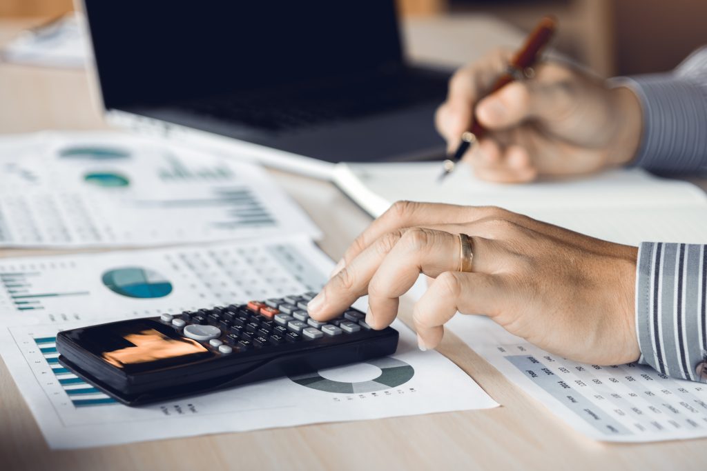 Corporate accountant and financial professional at desk
